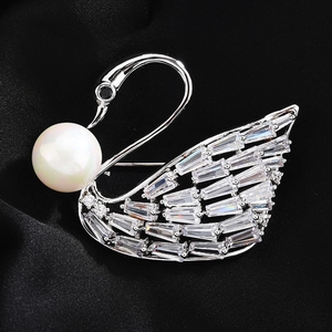 Elegant silver swan brooch with a large white pearl and sparkling zircon crystal wings