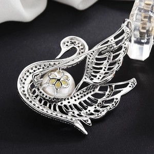 Elegant swan brooch with sparkling cubic zirconia crystals and white pearl detail for coats