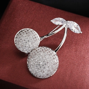 Exquisite cherry brooch with cubic zirconia stones on red textured jewelry gift box