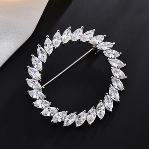 Elegant silver round brooch with marquise-cut cubic zirconia for coat and suit styling