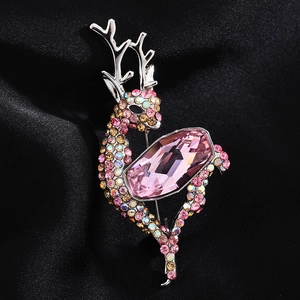 Elegant deer brooch with pink rectangular crystal and rhinestones on black satin