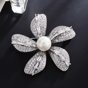 Elegant silver flower brooch with white pearl and sparkling cubic zirconia crystals