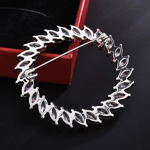 Elegant silver circular zircon brooch with marquise-cut stones for suit and coat lapels