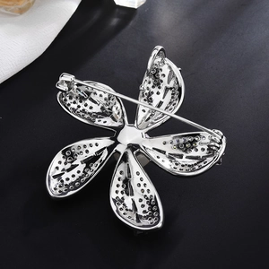 Elegant silver flower brooch with zircon and pearl, back view with secure pin clasp