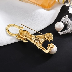 Elegant cheetah brooch with white pearl and pavé crystals in gold and silver finishes