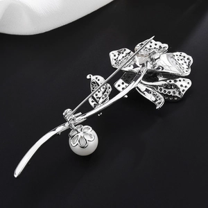 Elegant rose flower brooch featuring a high-gloss pearl pendant and silver hollow-out metal