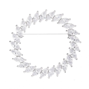 Elegant circular brooch featuring marquise-cut zircons set in polished silver-tone metal