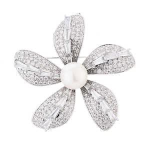 Elegant silver flower brooch with cubic zirconia petals and a center pearl detail