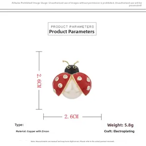 Detail showing ladybug brooch dimensions 2.6cm by 2.6cm with red enamel and pearls
