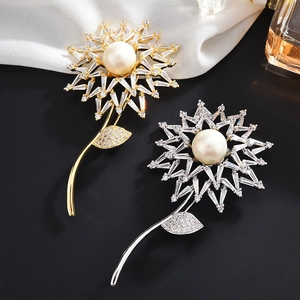 Elegant sunflower brooch set in gold and silver with white pearls and sparkling crystals