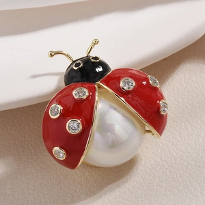 Elegant ladybug brooch with red enamel, sparkling rhinestones and a white pearl accent