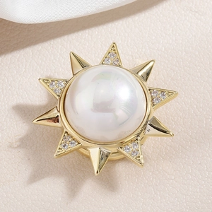 Golden sunflower magnetic brooch with a large white pearl and sparkling zircons