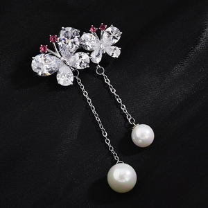 Elegant silver butterfly brooch with sparkling zircons and dangling white pearls