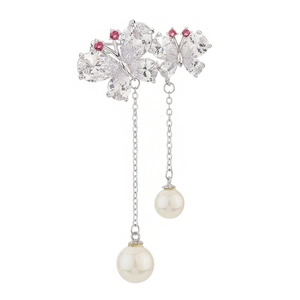Elegant butterfly tassel earrings with cubic zirconia and pearls on a white background