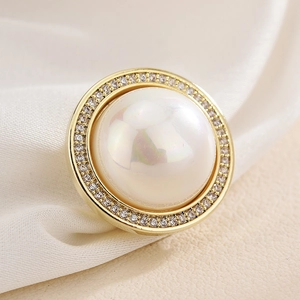 Elegant round magnetic brooch with a large central pearl and sparkling zircon halo