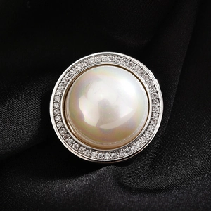 Elegant pearl magnetic brooch with zircon halo on premium black silk fabric