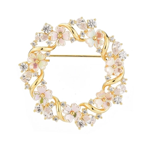 Elegant gold flower wreath brooch with pink enamel petals and sparkling cubic zirconia stones