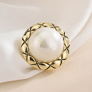 Elegant round gold magnetic brooch with quilted pattern and large white faux pearl inlay