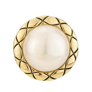 Elegant vintage gold metal brooch with central pearl and quilted texture details