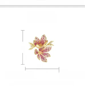 Detailed close-up of pink and red zircon flower brooch with gold plated copper leaves