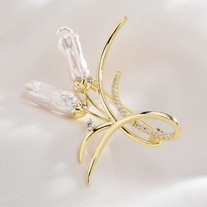 Elegant gold-plated flower brooch featuring baroque pearls and sparkling zircon accents