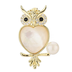 Elegant gold owl brooch with white mother of pearl heart and pearl accent for suits