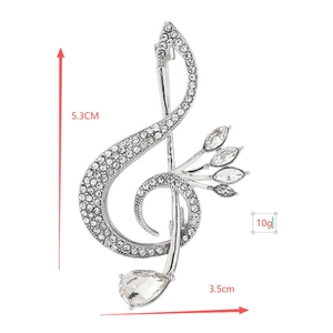 Detail view of musical note brooch with sparkling crystals and size dimensions shown
