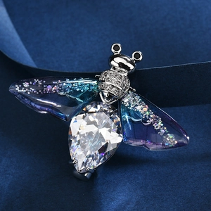Elegant insect bee brooch featuring a large teardrop zircon and blue gradient wings