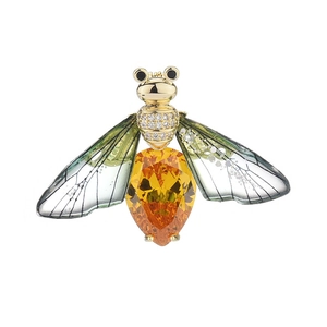 Elegant insect brooch with orange teardrop gemstone and green translucent wings