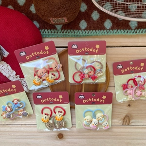 Cute cartoon puppy and bear hair clips set for girls on a warm wooden background