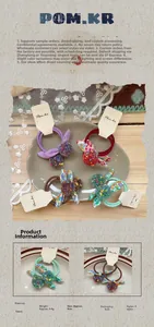 Detail showing colorful pom-poms and floral bunny ear bows on soft fabric hair ties