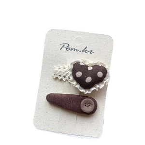 Brown polka dot heart and fabric button hair clip set for girls on a white display card