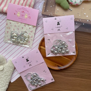 Set of sweet silver bow elastic hair ties with heart and star charms for girls