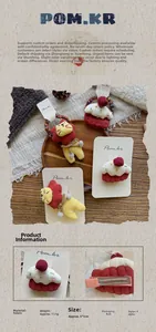 Detail view of lion and cupcake fabric hair clips showing measurements and texture