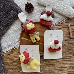Sweet autumn plush lion and cherry cake hair clips set for girls on warm background