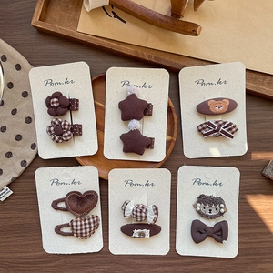 Handmade brown fabric hair clip set with stars and embroidery for women in autumn