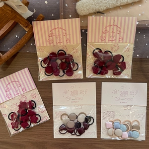 Handmade fabric hair ties set featuring geometric hearts and stars for girls