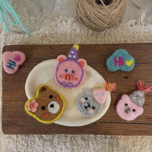 Handmade wool felt cartoon brooches featuring cute bear, pig, and koala animal shapes