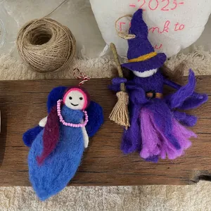 Handmade wool felt charms featuring a blue elf and a purple witch for bag decoration