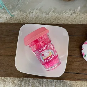 Close-up of pink elastic hair bands for kids in a creative mini coffee cup packaging