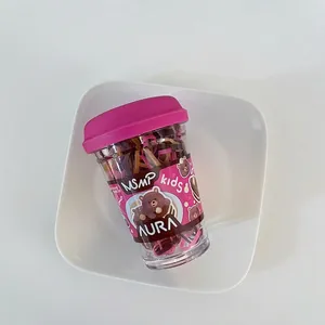 Bottled colorful elastic hair bands for girls in a portable clear cup with pink lid