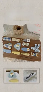 Detail view of handmade blue fabric hair clips with floral and plaid patterns