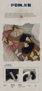 Detailed view of lace heart and embroidered butterfly hair clips with glitter accents