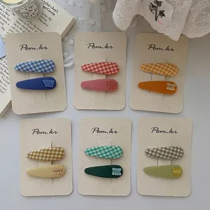 Set di fermagli per capelli in tessuto a quadretti e volant in 6 vivaci colori candy