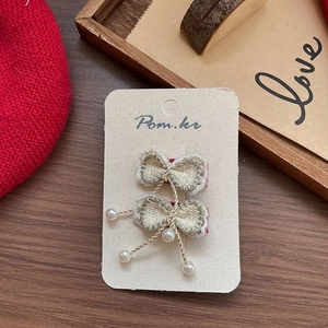 Barrettes à nœuds blanc crème faites à la main avec bord doré et perles élégantes