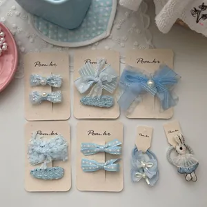 Ensemble de barrettes à nœuds bleu clair et élastiques lapin à perles pour filles