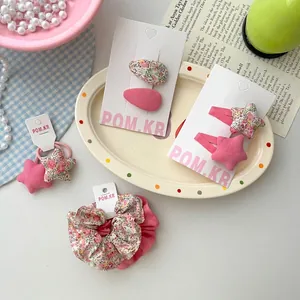 Set d'accessoires à cheveux à fleurs avec pinces étoile et chouchous en tons roses