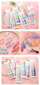 Vue détaillée des barrettes à cheveux en métal coloré avec motifs pour filles en coffret