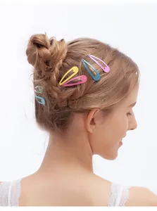 Colorful candy-colored metal hair clips styled on braided hair for girls decoration