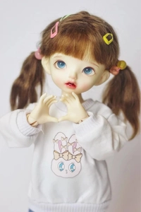 Close-up of 2cm mini colorful drip glue hair clips on a sweet BJD doll with pigtails